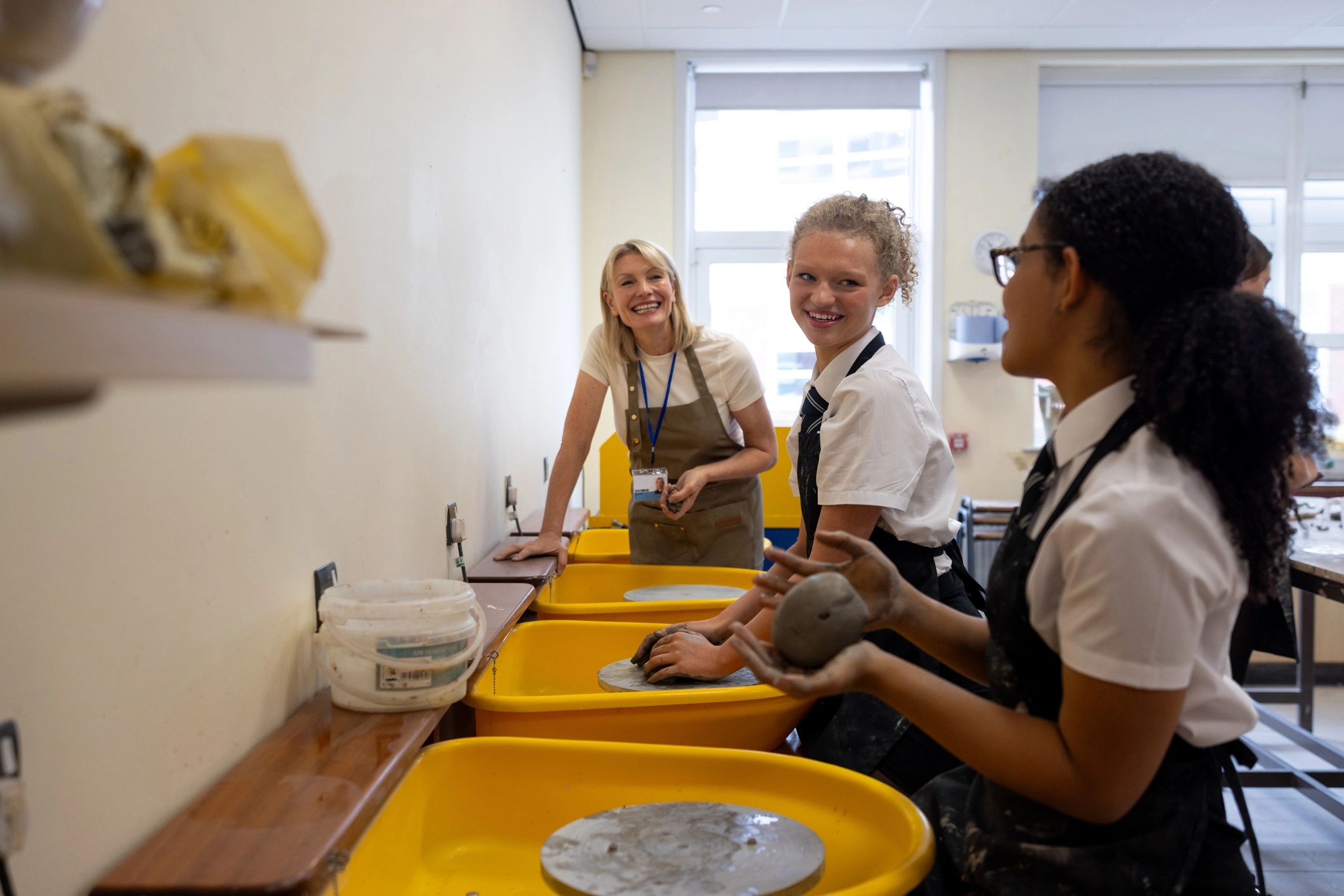 Instructor guiding students in a hands-on learning session