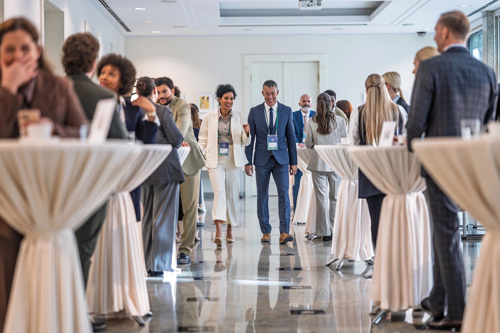 Professionals in conversation at a welcoming lifestyle and education event